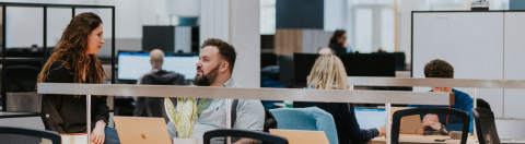 Industry_Marketing_Article_Hero_CTA UCAS staff having a conversation in the Rosehill office, Cheltenham