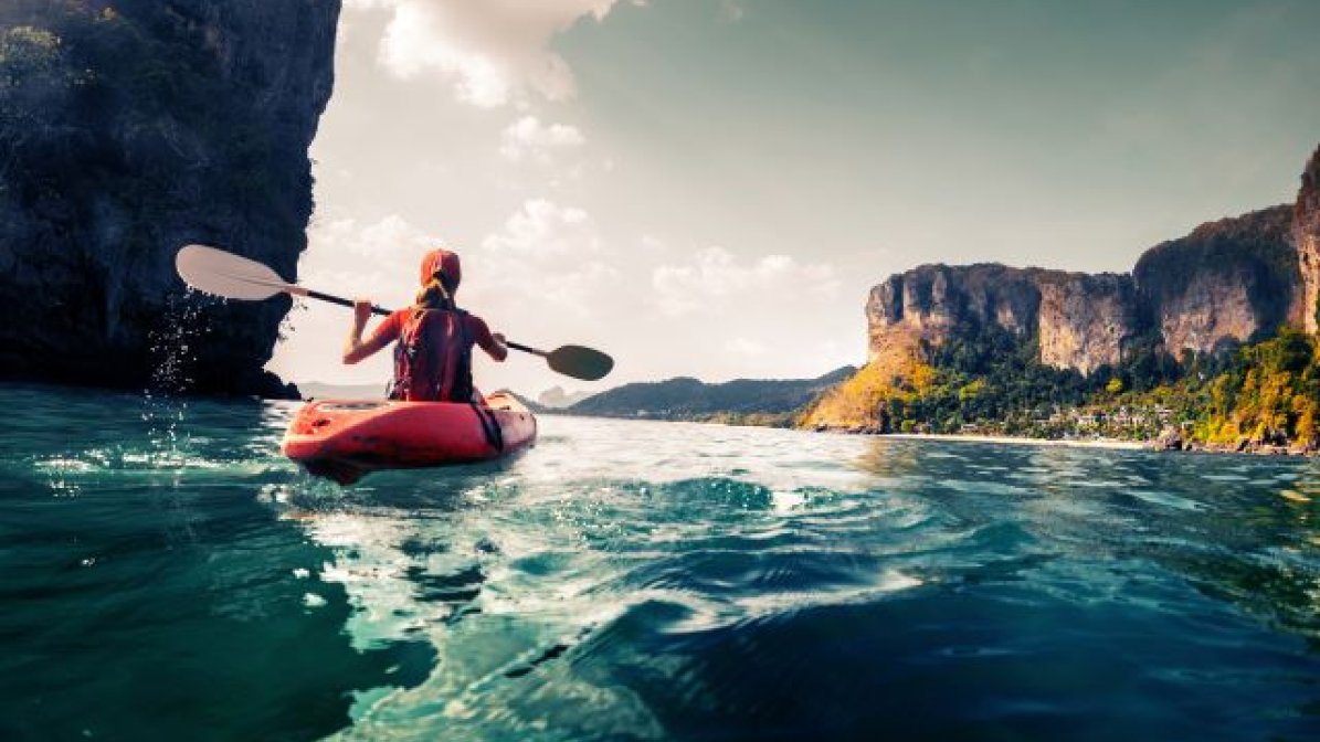 Student kayaking on the sea