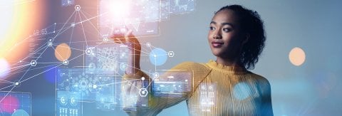 female interacting with data hologram